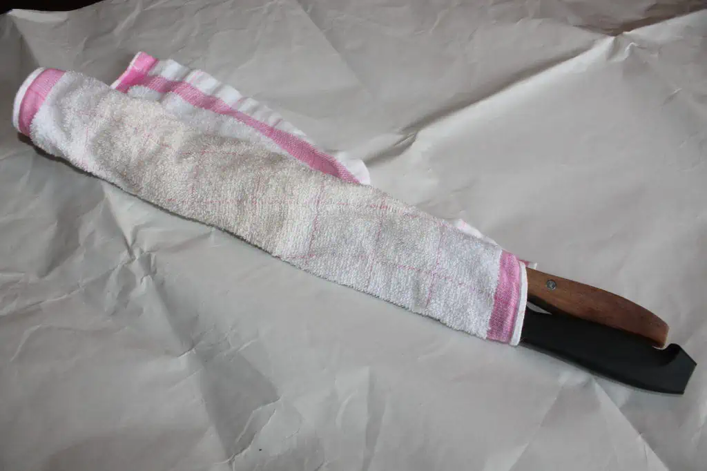 two knives wrapped in a towel