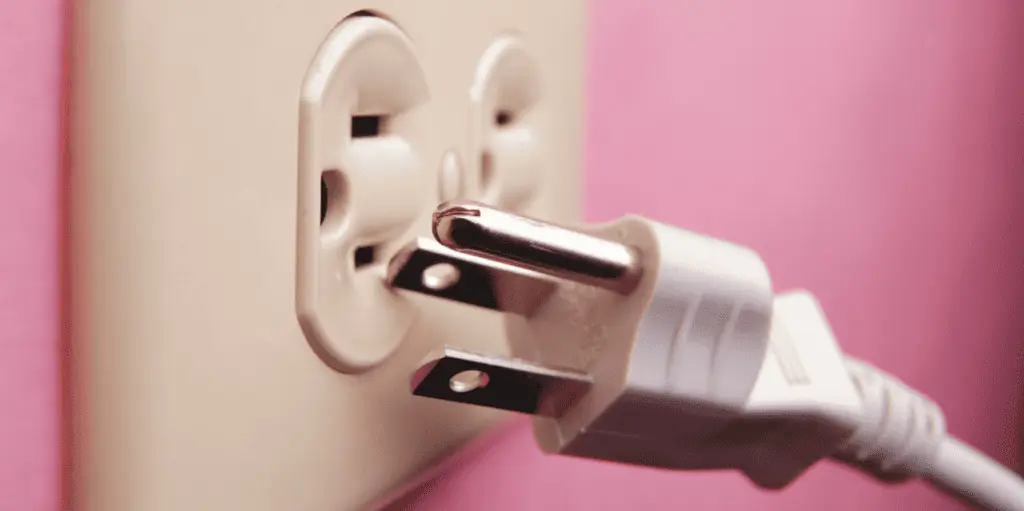 an image of an electrical plug being unplugged