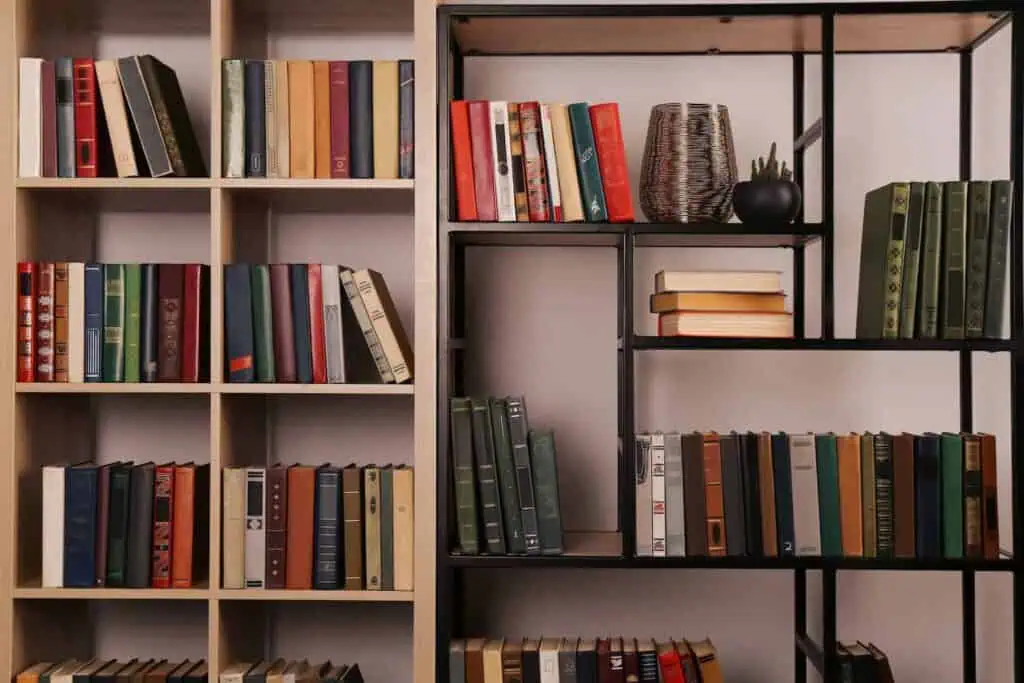 A set of bookshelves that are packed with books of different sizes and colors
