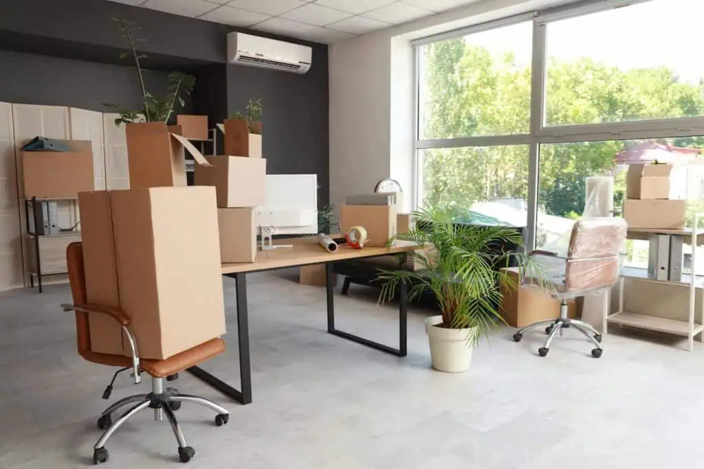 an image of an office being packed up, as well as several office chairs