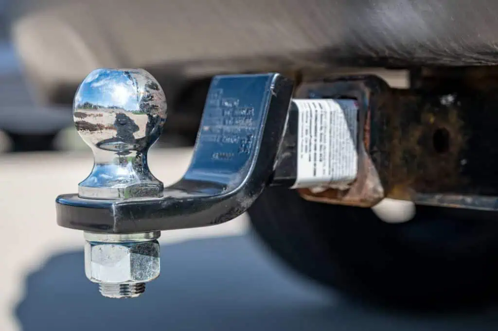 An image of a silver towing hitch on a vehicle