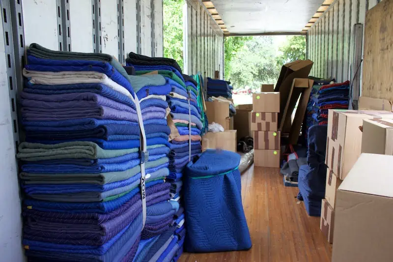 furniture pads packed neatly in a moving truck