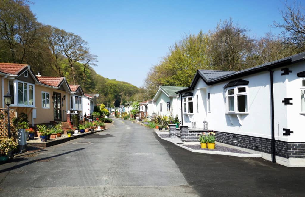 a lane of mobile homes in different styles and colors