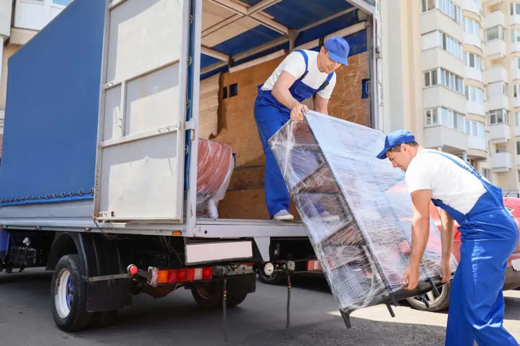 movers loading furniture into a truck