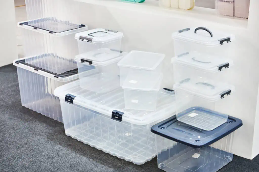 a stack of plastic storage containers in varying sizes