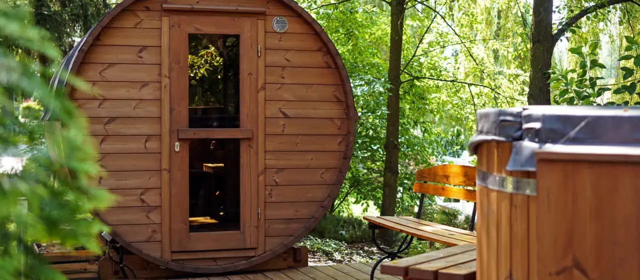 a wooden outdoor barrel sauna