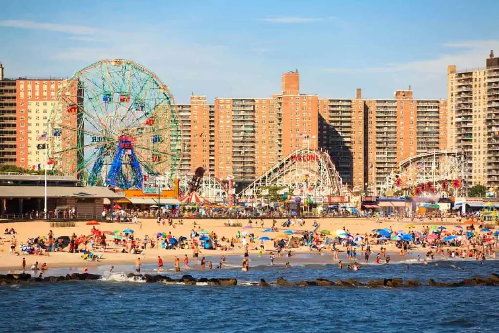 a view of coney island's beach and attractions in the brighton beach neighborhood of brooklyn