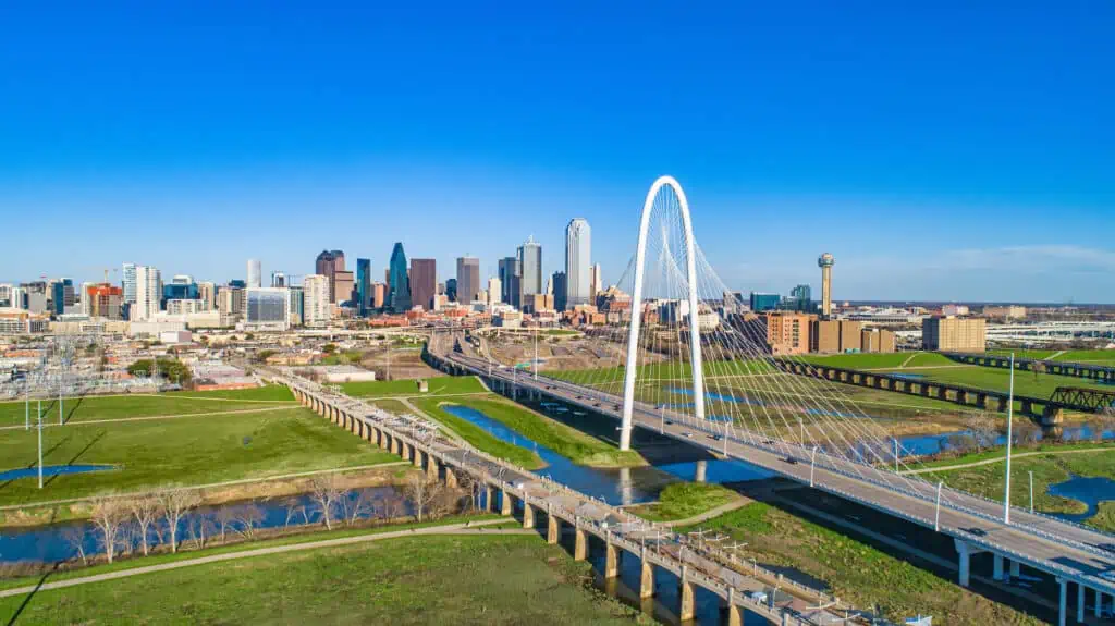 a view of the Margaret Hunt Hill Bridge leading into downtown Dallas