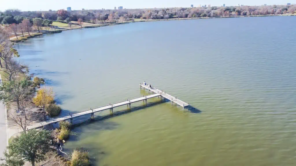 A view of a fishing dock in White Rock Lake, which is near Lake Highlands. The downtown skyline of Dallas can be seen in the distance