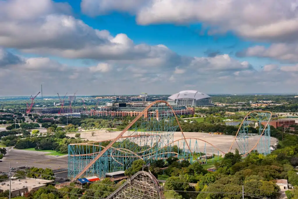a view of Arlington's skyline, featuring the Rangers' stadium and Six Flags roller coasters