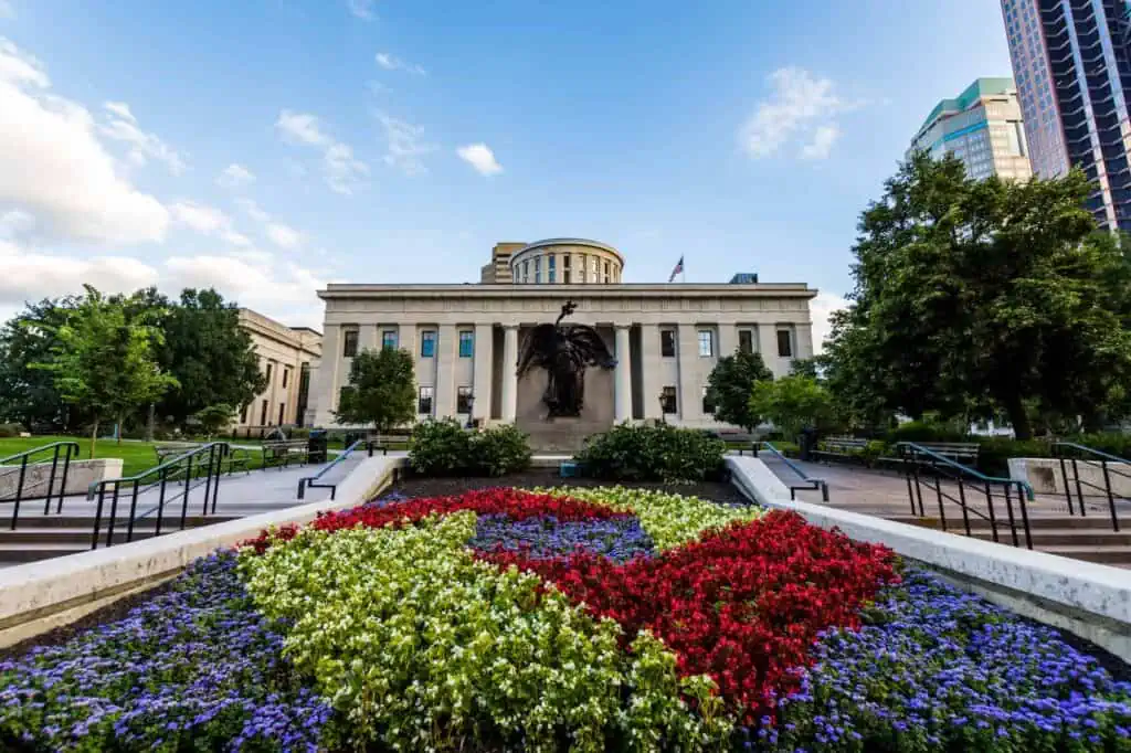The Ohio Statehouse and grounds in the Uptown district of Columbus, OH