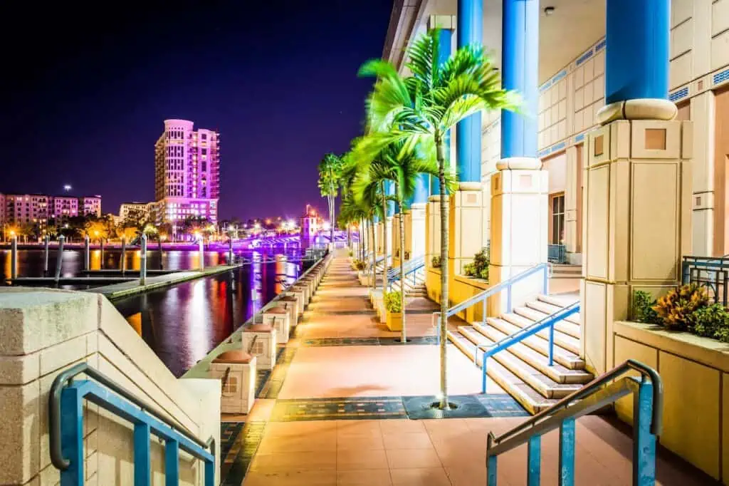 A view of the Riverwalk at night in Tampa, FL's downtown district