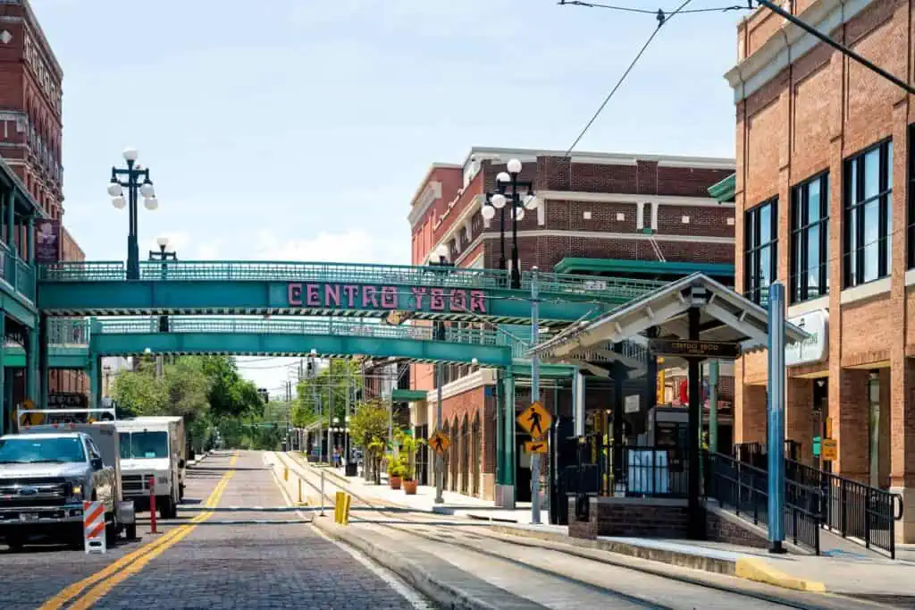 A bridge over a street in Tampa, FL's historic Ybor District. The sign on the side reads "Centro Ybor" 