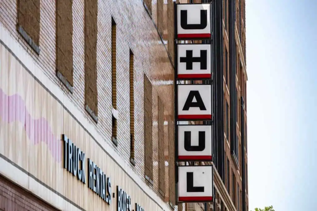 A view of a sign on the side of a uhaul building