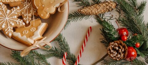 A festive table adorned with an assortment of Christmas cookies and colorful decorations, creating a joyful holiday atmosphere.