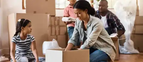 Image of a family moving with kids