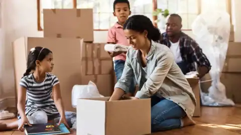 Image of a family moving with kids