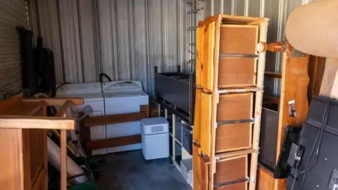 A storage unit filled with furniture
