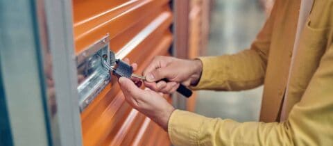 a person locks up their storage unit