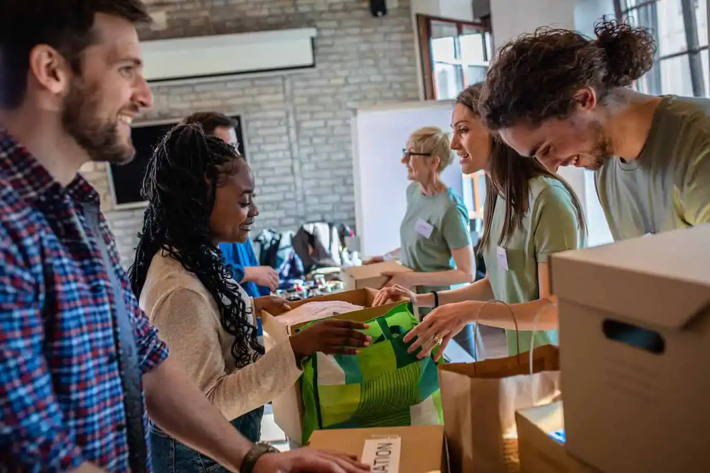 People doing community work by sorting donations and supplies.