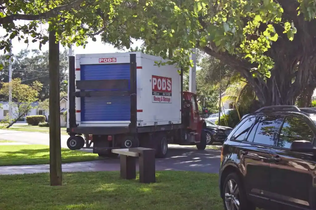 PODS container being transported on a truck for moving and storage service