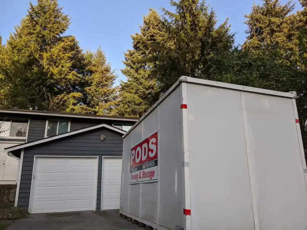 PODS moving and storage container parked in front of residential home
