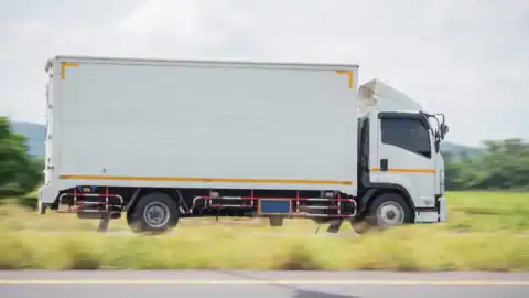 Moving truck driving on highway