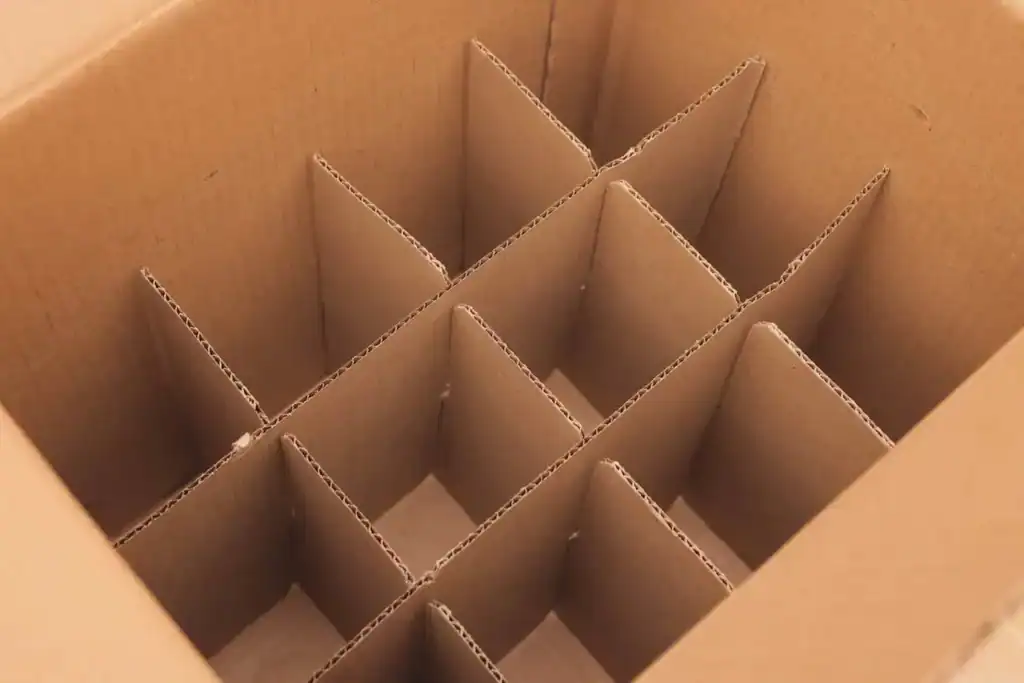 Cardboard dish pack box with dividers for packing dishes and glassware safely during a household move.