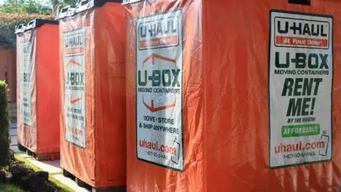 An image of four U-box units set in a row on a curb