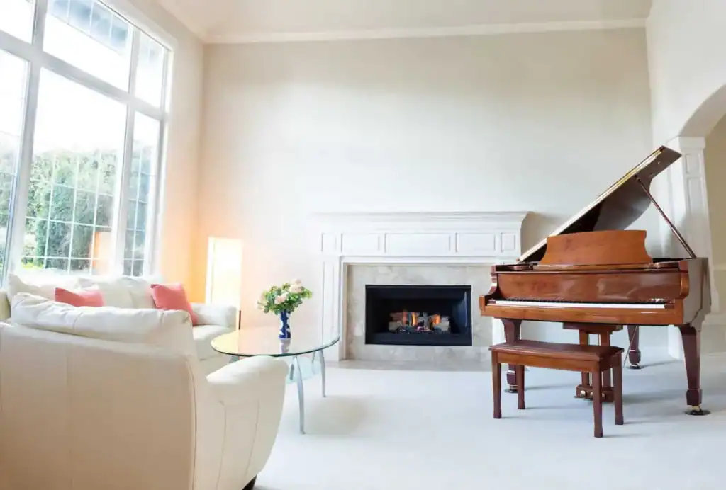 A piano in the back of a living room