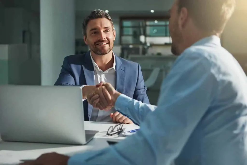 Businessman shaking hands during a meeting to finalize a deal