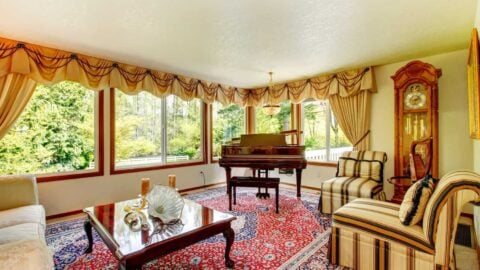 An old-fashioned living room filled with antique furniture