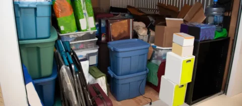 Packed storage unit containing containers, boxes, and furniture